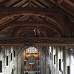 Rope access technician removing a disused sound sphere from the roof of St George's Church